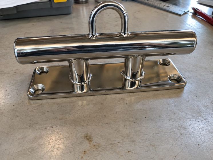 Polished stainless cleat on the workbench
