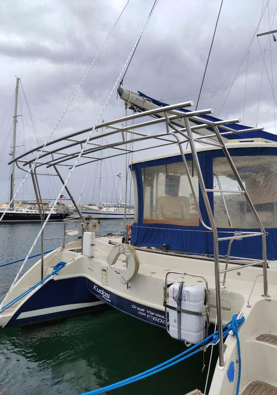 Bimini and arch frame on a blue-hulled yacht
